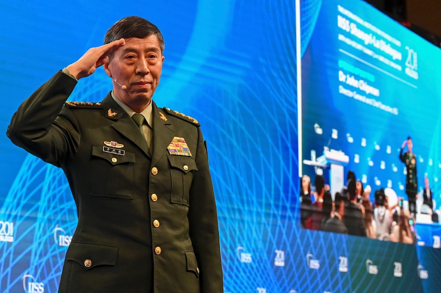 Chinese Defense Minister Li Shangfu waves to the audience before addressing the Shangri-La Conference on Dialogue on June 4, 2023 in Singapore.