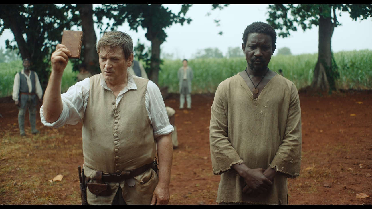 Benoît Magimel (left) plays the role of an evil slaveholder, a ruthless plantation manager.