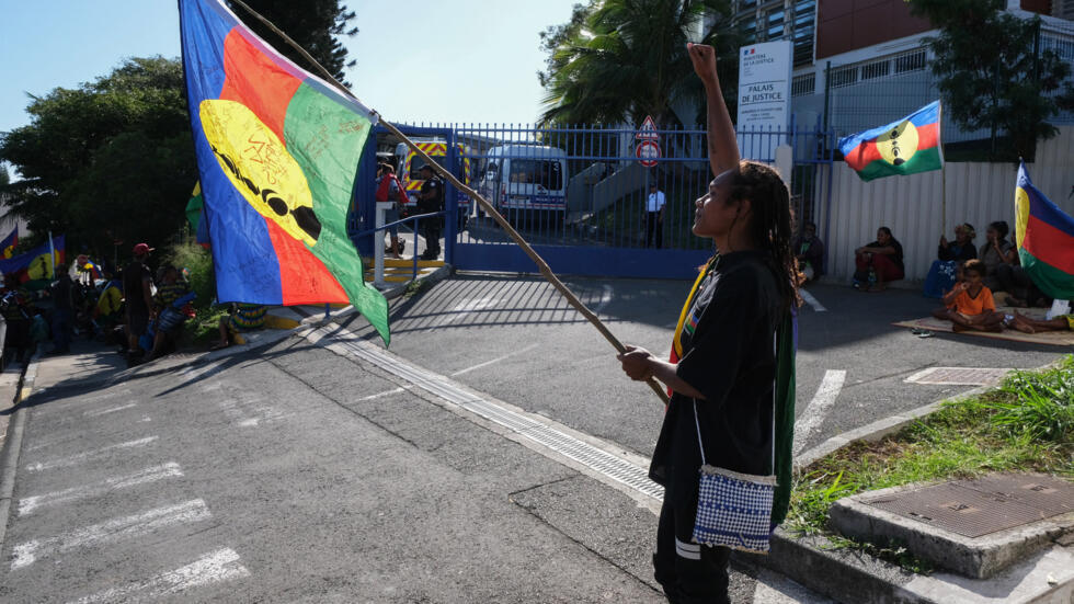 Protesters take part in the rally organized by the Field Coordination Unit (CCAT) in front of the Noumea courthouse in support of the 14 activists tried for obstructing traffic and damaging property, on May 13, 2024.