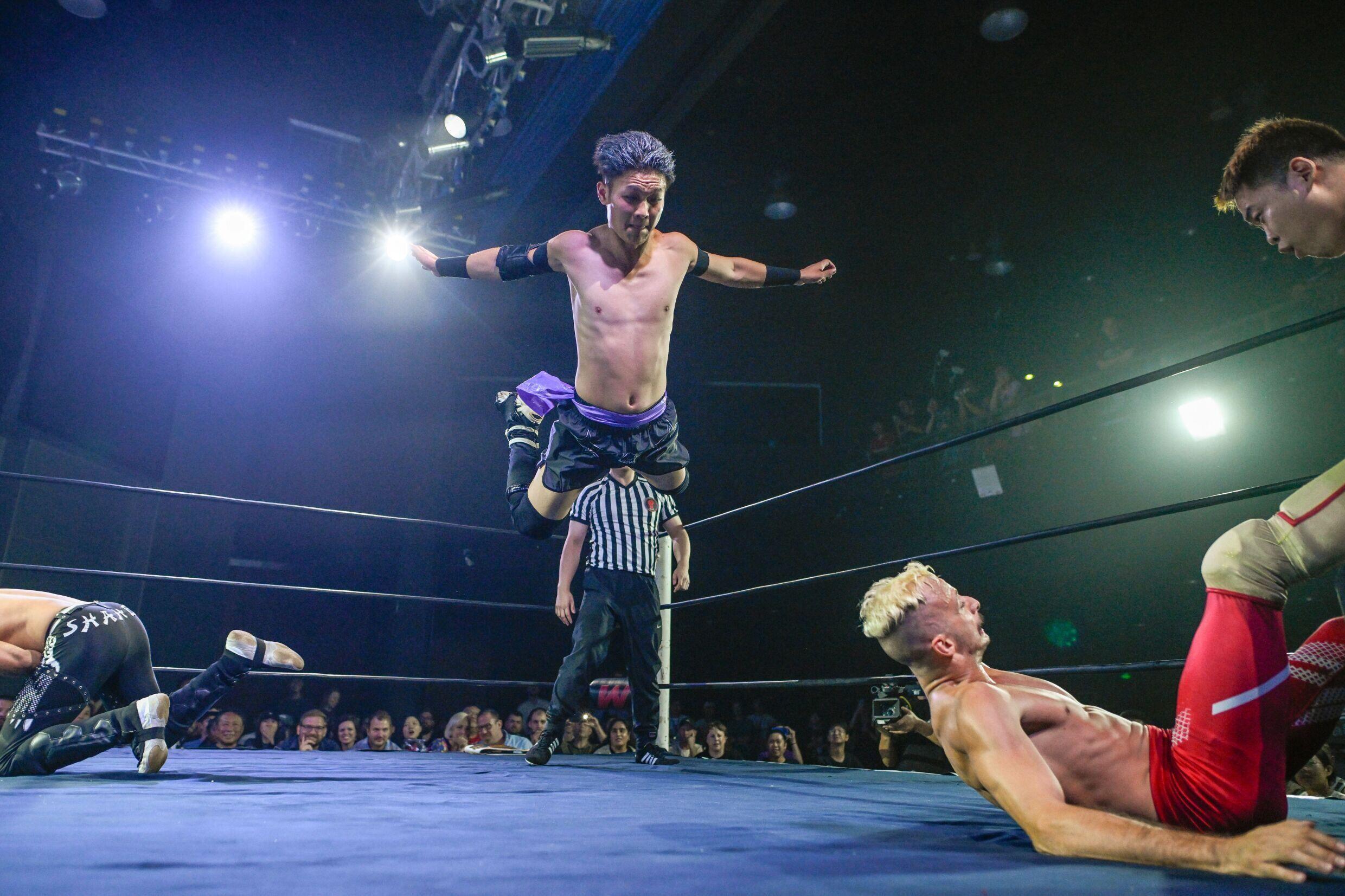 Wrestler Wang Tao jumps on his opponent during a Middle Kingdom Wrestling (MKW) championship on September 14, 2024 in Shanghai.