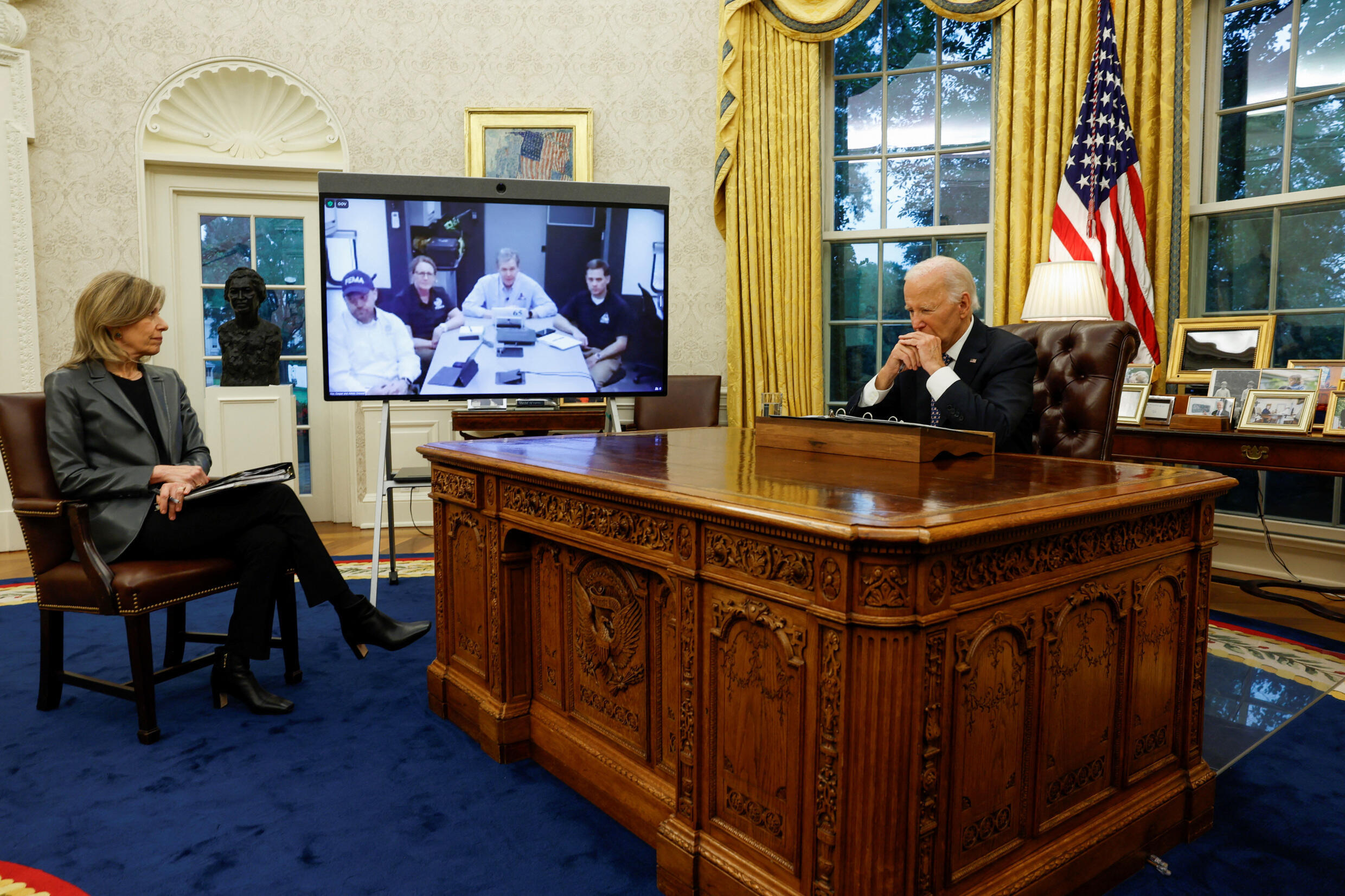 U.S. President Joe Biden and Homeland Security Advisor Liz Sherwood-Randall sit in the Oval Office as Biden provides an update on Hurricane Helen response and recovery efforts, at the White House in Washington, Washington, March 30 September 2024.