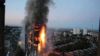 Britain apologizes to victims of Grenfell tower block fire