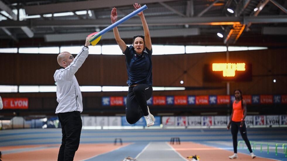 French Paralympic athlete Delya Boulaghlem, competing in sprint and long jump, takes part in a training session with her coach and guide Thomas Verro for the Paris 2024 Paralympic Games on May 7, 2024 in Lyon.