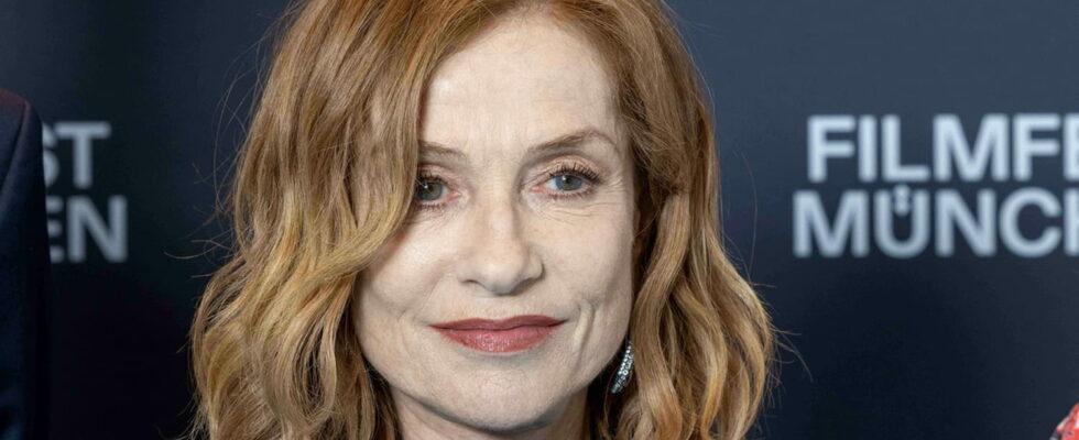 With her notched bob and red lips Isabelle Huppert takes